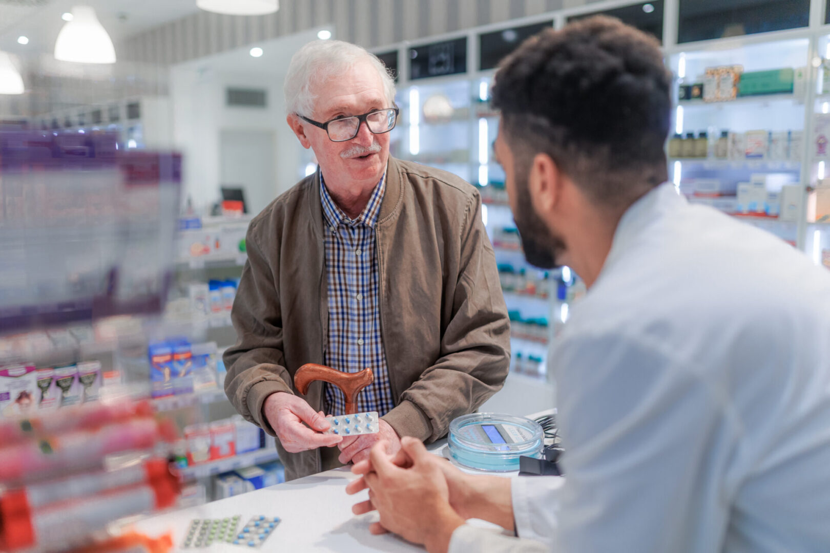 A man is talking to another man in the store.