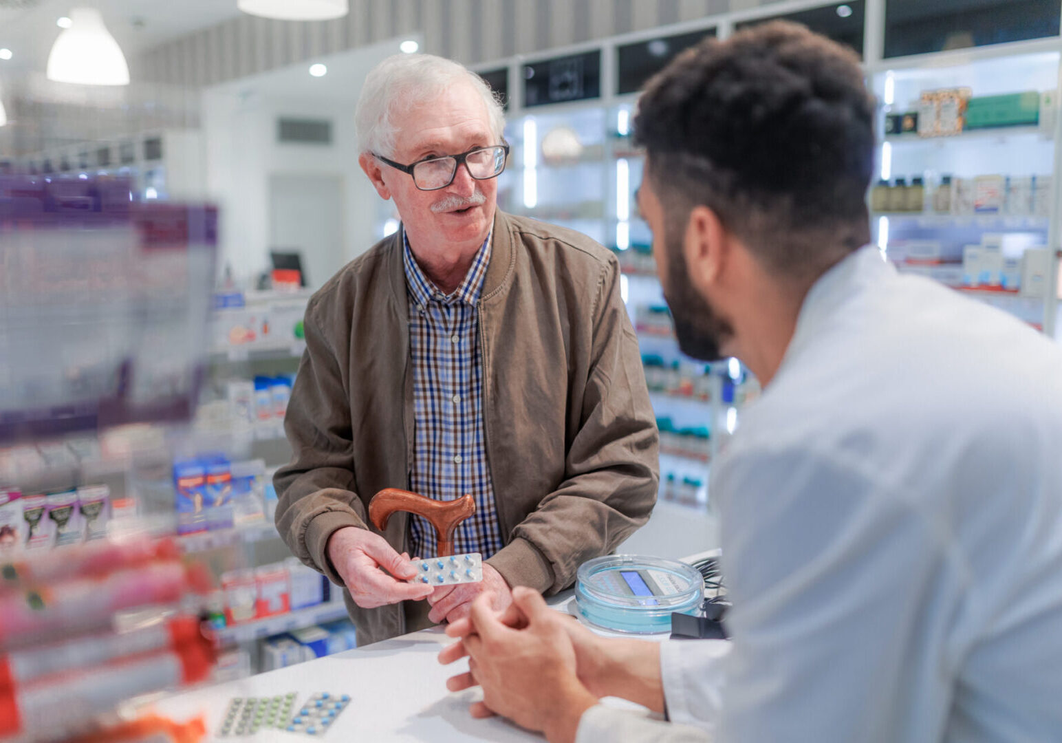 A man is talking to another man in the store.